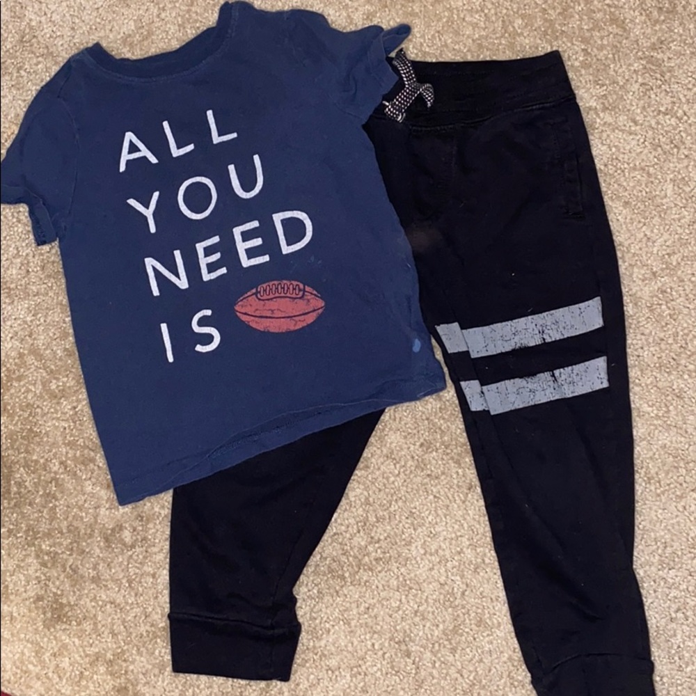 Black sweat pants and football tshirt